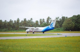 A Dash-8 aircraft bearing logo and body-paint of Maldivian--