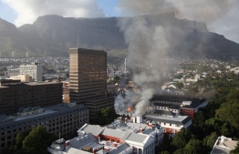 A general view of a building on fire at the South African Parliament precinct in Cape Town on January 2, 2022. -- Photo: AFP