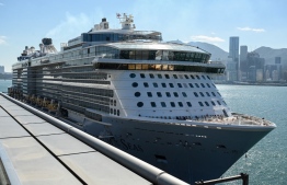 The cruise ship "Spectrum of the Seas" is docked at a terminal in Hong Kong on January 5, 2022, after it was ordered to return to the city for coronavirus testing after nine people were found to be close contacts with a recent Omicron variant outbreak. -- Photo: Peter Parks / AFP