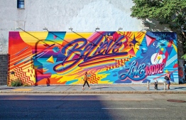 An iconic graffiti mural in a solemn street of NYC -- Photo: Time Out