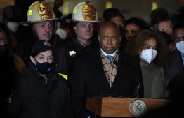 New York City Mayor Eric Adam speaks during a press conference near the scene of the fatal fire of an apartment building in the Bronx, on January 9, 2022, in New York. - At least 19 people have died and dozens are injured after a fire tore through a high-rise apartment. -- Photo: Ed Jones / AFP