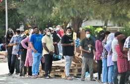 (FILE) People queuing outside Social Center to take Covid tests on January 10, 2022: Maldives will be administering 100,620 doses of the Pfizer vaccine they received from United States to administer the booster shots -- Photo: Fayaz Moosa / Mihaaru