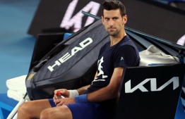 Novak Djokovic of Serbia attends a practice session ahead of the Australian Open tennis tournament in Melbourne on January 14, 2022. -- Photo: Martin Keep/ AFP