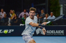 Thanasi Kokkinakis of Australia hits a return against Arthur Rinderknech of France in the men's singles final match at Adelaide International ATP 250 tennis tournament in Adelaide on January 15, 2022. -- Photo: Brenton Edwards / AFP