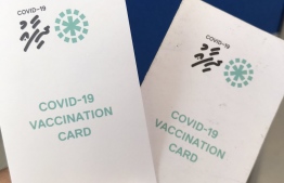 (FILE) Photo of the Covid-19 vaccine card issued in Maldives, taken on January 16, 2022: the fourth dose of the Covid vaccine will be administered four months after the third shot was administered -- Photo: Mihaaru