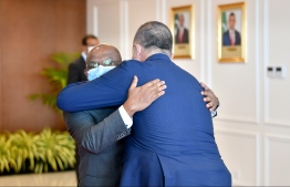 Foreign Minister Abdulla Shahid (R) and Turkish Foreign Minister Mevlüt Çavuşoğlu hugs -- Photo: Nishan Ali / Mihaaru