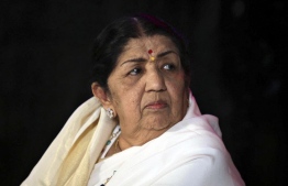 (FILES) In this file photo taken on June 18, 2010 singer Lata Mangeshkar attends the launch of photographer Gautam Rajadhyaksh’s Marathi coffee table book “Chehere” in Mumbai. Beloved Bollywood singer Lata Mangeshkar has died at the age of 92. -- Photo: AFP