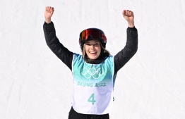 Gold medallist China's Gu Ailing Eileen celebrates on the podium during the medals ceremony after the freestyle skiing women's freeski big air final run during the Beijing 2022 Winter Olympic Games at the Big Air Shougang in Beijing on February 8, 2022:  -- Photo: Manan Vatsyayana/ AFP