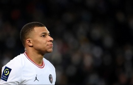 Paris Saint-Germain's French forward Kylian Mbappe reacts during the French L1 football match between Paris-Saint Germain (PSG) and Le Stade rennais Football Club at The Parc des Princes Stadium in Paris on February 11, 2022. --  Photo: Franck Fife / AFP