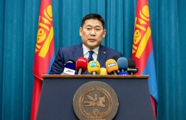 This photo taken on February 14, 2022 shows Mongolia's Prime Minister Luvsannamsrai Oyun-Erdene speaking during a meeting to announce the reopening of Mongolia's borders to international travel, in Ulaanbaatar, the capital of Mongolia. -- Photo: Byambasuren Byamba-Ochir /AFP