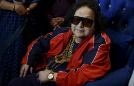(FILES) In this file photo taken on June 19, 2021, Bollywood singer, music composer Bappi Lahiri interacts with the media before planting a tree during an environment awareness campaign in Mumbai. - Lahiri was admitted to a hospital in Mumbai and his death was announced on February 16, 2022. -- Photo: Sujit Jaiswal / AFP