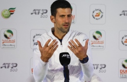 A handout picture made available by the press office of the Dubai Duty Free Tennis Championship on February 20, 2022 shows Serbian Tennis player Novak Djokovic holding a press conference ahead of the ATP Dubai Duty Free Tennis Championship in the Gulf emirate of Dubai. -- Photo: jorge ferrari / Dubai Duty Free Tennis Championship / AFP