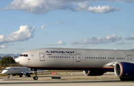 A Russian Aeroflot airlines plane takes off from Los Angeles International Airport (LAX) on February 22, 2022. - Canada has closed its airspace to all Russian carriers in protest of the Russian invasion of Ukraine, Ottawa announced on February 27, 2022. While there had been no direct flights between Canadian and Russian airports, the decision by the world's second-largest country -- Russia is the largest -- could seriously complicate flights by Russian carrier Aeroflot to or from the US, as well as to other countries to the south. (Photo by Daniel SLIM / AFP)