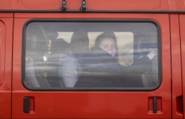 Ukrainian citizens are seen in bus arriving at the Medyka border crossing fleeing the conflict in their country, in eastern Poland on February 27, 2022. - As Ukraine braces for a feared Russian invasion, its EU member neighbours are making preparations for a possible influx of hundreds of thousands or even millions of refugees fleeing military action. (Photo by Wojtek RADWANSKI / AFP)