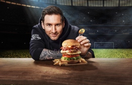 Lionel Messi with Messi Burger -- Photo: Crossroads
