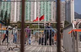 People arrive at a Covid-19 testing centre in Hong Kong on March 2, 2022. -- Photo: Dale De La Rey / AFP