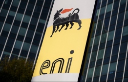 (FILES) This file photo taken on October 27, 2017, shows the logo on the headquarters of Italian oil and gas company Eni in San Donato Milanese, near Milan. - Italian oil giant Eni said on March 1, 2022, that it would withdraw from the Blue Stream gas pipeline linking Russia to Turkey in which it has a 50 percent stake, following rivals BP and Shell which have divested from Russia-linked projects after Moscow invaded Ukraine. -- Photo: Marco Bertorello / AFP