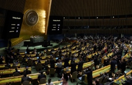 Delegates clap at the UN General Assembly Emergency session in New York on March 2, 2022, after a resolution condemning Russian invasion of Ukraine passed. - The UN overwhelmingly adopted a resolution that "demands" Russia "immediately" withdraw from Ukraine, in a powerful rebuke of Moscow's invasion by the global body charged with peace and security. (Photo by TIMOTHY A. CLARY / AFP)