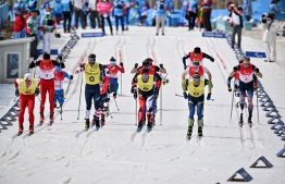 Competitors start the open relay para cross-country skiing event on March 13, 2022, at the Zhangjiakou National Biathlon Centre during the Beijing 2022 Winter Paralympic Games. -- Photo: Lillian Suwanrumpha / AFP