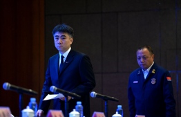 Zhu Tao (L), director of China Civil Aviation Administration's  Flight Standards Department, and Zheng Xi (R), head of the Guangxi Fire and Rescue Squad, arrive for a press conference following the March 21 crash of China Eastern flight MU5375, at a hotel in Wuzhou on March 24, 2022. --Photo: Noel Celis| AFP