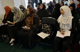 A group of Afghan women activists attend a press conference in Kabul on March 27, 2022, to demand reopening of secondary schools for girls across the country. -- Photo: Ahmad Sahel Arman | AFP