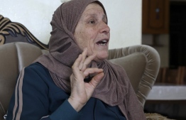 Houria Sabatien, mother of Palestinian woman Ghada Sabatien who was shot by an Israeli soldier on April 10, speaks during an interview with AFP at her home in the village of Husan near Bethlehem in the occupied West Bank on April 18, 2022. - When Ghada Sabatien set out to visit her uncle in a village near Bethlehem, she was not expecting to be caught up in the spike in violence between Israelis and Palestinians.
But the 45-year-old, who was partially sighted and understood little Hebrew, bled to death in the street after being shot by an Israeli soldier, which the army said was a "mistake". (Photo by HAZEM BADER / AFP)