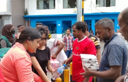 Ooredoo employees distributing meal packs on Friday, April 22 -- Photo: Ooredoo