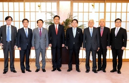 This handout picture taken on April 25, 2022 and provided by the Ministry of Foreign Affairs of Japan shows Chung Jin-suk (4th L), deputy speaker of South Korea's National Assembly and the head of a delegation sent by South Korean President-elect Yoon Suk-yeol to Japan, posing for a photo with Japan's Foreign Minister Yoshimasa Hayashi (4th R) during their meeting at the Foreign Ministry in Tokyo. -- Photo by Handout / Ministry of Foreign Affairs of Japan / AFP