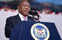 South African President, Cyril Ramaphosa, delivers a speech during the memorial service for former Kenyan President Mwai Kibaki at the Nyayo National Stadium in Nairobi on April 29, 2022. (Photo by TONY KARUMBA / AFP)