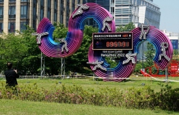 (FILES) This file photo taken on May 6, 2022 shows a countdown clock displaying 127 days until the opening of the 2022 Asian Games in Hangzhou, in China's eastern Zhejiang province. - China's ambitions to be a global sporting hub took a heavy blow as the May 6, 2022 postponement of this year's Asian Games further isolated a country already cut off by its hardline zero-Covid strategy. -- Photo: AFP