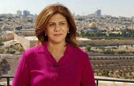 An undated handout photo released by the Doha-based Al-Jazeera TV shows the channel's veteran journalist Shireen Abu Aqleh during one of her reports from Jerusalem. - Abu Aqleh, 51, a prominent figure in the channel's Arabic news service was shot dead by Israeli troops early on May 11, 2022 as she covered a raid on Jenin refugee camp in the occupied West Bank, according to the network. -- Photo: Al Jazeera / AFP