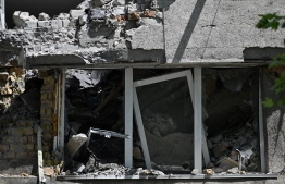 A picture taken on May 24, 2022, shows a building of hotel Ingul, destroyed by a Russian missile strike in March 2022, in the southern Ukrainian city of Mykolaiv, amid the Russian invasion of Ukraine. -- Photo: Genya Savilov / AFP