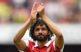 Arsenal's Egyptian midfielder Mohamed Elneny celebrates at the end of the English Premier League football match between Arsenal and Everton at the Emirates Stadium in London on May 22, 2022. -- Photo: Daniel Leal / AFP