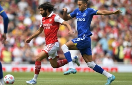 Arsenal's Egyptian midfielder Mohamed Elneny (L) challenges Everton's English striker Dominic Calvert-Lewin during the English Premier League football match between Arsenal and Everton at the Emirates Stadium in London on May 22, 2022. - Photo by Daniel Leal / AFP
