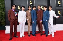 (FILES) In this file photo taken on April 03, 2022 South Korean boy band BTS arrives for the 64th Annual Grammy Awards at the MGM Grand Garden Arena in Las Vegas. - President Joe Biden will receive the K-pop megastars BTS next week as part of a series of events celebrating Asian-Americans and denouncing racism against them, the White House said May 26, 2022. --Photo: Angela Weiss / AFP