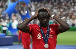 Liverpool's Senegalese striker Sadio Mane reacts after losing  the UEFA Champions League final football match between Liverpool and Real Madrid at the Stade de France in Saint-Denis, north of Paris, on May 28, 2022.  -- Photo: Frank Fife / AFP