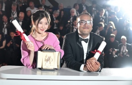 Chinese director Jianying Chen (L) attends a photocall after she won the Palme d'Or - Short Film for the film "The Water Murmurs" next to Nepalese director Abinash Bikram Shah who won a special mention for his film "Lori" at the 75th edition of the Cannes Film Festival in Cannes, southern France, on May 28, 2022. -- Photo: Loic Venance / AFP
