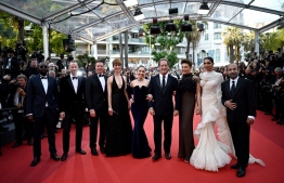 French actor and President of the Jury of the 75th Cannes Film Festival Vincent Lindon (4thR) arrives with (from L) French director Ladj Ly, Norwegian film director Joachim Trier, US film director Jeff Nichols, British actress Rebecca Hall, Swedish actress Noomi Rapace, Italian actress Jasmine Trinca, Indian actress Deepika Padukone and Iranian film director Asghar Farhadi for the Closing Ceremony of the 75th edition of the Cannes Film Festival in Cannes, southern France, on May 28, 2022. (Photo by LOIC VENANCE / AFP)