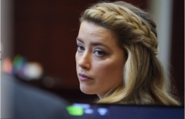 Actor Amber Heard arrives for closing arguments in the Depp v. Heard trial at the Fairfax County Circuit Courthouse in Fairfax, Virginia, on May 27, 2022. Actor Johnny Depp is suing ex-wife Amber Heard for libel after she wrote an op-ed piece in The Washington Post in 2018 referring to herself as a “public figure representing domestic abuse.” -- Photo: Steve Helber AFP