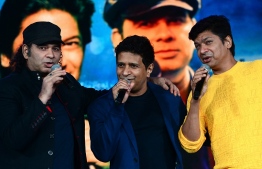 (FILES) In this file photo taken on September 27, 2021 Bollywood singers Mohit Chauhan (L), Krishnakumar Kunnath -- popularly known as KK (C) and Shaan attend a concert in Mumbai. - KK, died of a heart attack at age 53 after a concert May 31, 2022, Indian media reported, prompting a flood of tributes from fans including Prime Minister Narendra Modi. -- Photo: Sujit Jaiswal / AFP