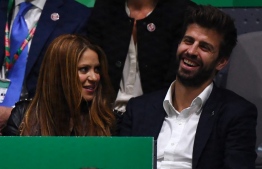 (FILES) This file photo taken on November 24, 2019 shows Colombian singer Shakira and her husband Barcelona's Spanish defender and Kosmos president Gerard Pique watching Spain's Rafael Nadal playing Canada's Denis Shapovalov during the final singles tennis match between Canada and Spain at the Davis Cup Madrid Finals 2019 in Madrid. - Colombian superstar Shakira and FC Barcelona defender Gerard Pique said on June 4, 2022  they were calling time on their relationship of more than a decade. The couple share two children. -- Photo: Gabriel Bouys / AFP
