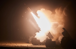 This handout photo taken on June 6, 2022 and released by South Korea's Joint Chiefs of Staff via Yonhap news agency in Seoul shows the Army Tactical Missile System (ATACMS) firing a missile from an undisclosed location on South Korea's east coast during a South Korea-US joint live-fire exercise aimed to counter North Korea’s missile test. South Korea and the United States fired eight ballistic missiles on June 6 in response to North Korean weapons tests the previous day, Seoul's military said.