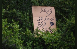 A carboard sign in protest of City Council's decision of shifting fiber boatyard to the east-end side of Vilimale' -- Photo: Ahmed Aiham | Social Media