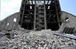 A photograph shows a destroyed storage facilities in a port of a private company, Nika-Tera, in the southern city of Mykolaiv on June 12, 2022, which was bombed on June 4, according to the military administration: a report from an independent Finland-based Centre for Research on Energy and Clean Air (CREA) said in their report that EU took 61 percent of Russia's fossil fuel exports during the war's first 100 days, worth about 57 billion euros -- Photo: Genya Savilov / AFP