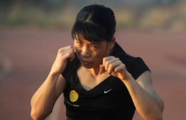 (FILES) In this file photo taken on April 20, 2012 Indian woman boxer MC Mary Kom warms up during a training session at the Balewadi Sports Complex in Pune, about 180 km (112 miles) from Mumbai on April 20, 2012, ahead of the 2012 Olympics which will be held in London. - Former world champion Mary Kom has been ruled out of the Commonwealth Games later this year due to a knee injury. -- Photo: Punit Paranjpe / AFP