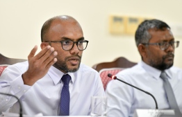 Minister of Finance Ibrahim Ameer (L)--
