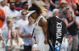 (FILES) In this file photograph taken on July 1, 2019, Japan's Naomi Osaka looks downwards as she leaves the court after being defeated by Kazakhstan's Yulia Putintseva during their women's singles first round match on the first day of the 2019 Wimbledon Championships at The All England Lawn Tennis Club in Wimbledon, southwest London. Former world number one Naomi Osaka pulled out of Wimbledon on June 18, 2022, with an Achilles injury."My Achilles still isn’t right so I'll see you next time," the four-time Grand Slam winner posted on Twitter.-- Photo: Adrian Dennis / AFP