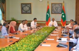 President Solih flanked by members of the cabinet during Tuesday evening's meeting --