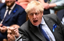 A handout photograph released by the UK Parliament shows Britain's Prime Minister Boris Johnson gesturing as he speaks during the weekly Prime Minister's Questions (PMQs) session in the House of Commons, in London, on June 22, 2022. -- Photo: Jessica Taylor / UK Parliament / AFP