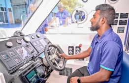 A speed-boat captain at the helm of the vessel's navigation setup; these high-speed ferries will be utilized in MTCC's Raajje-Transport Link (RTL) services -- Photo: Nishan Ali | Mihaaru